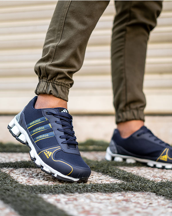 کفش ورزشی Adidas مردانه سرمه ای زرد مدل Artek