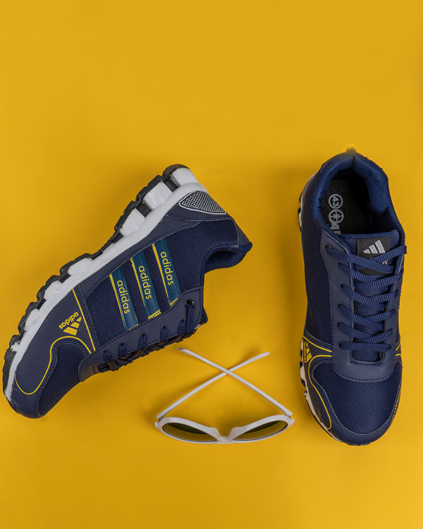 کفش ورزشی Adidas مردانه سرمه ای زرد مدل Artek