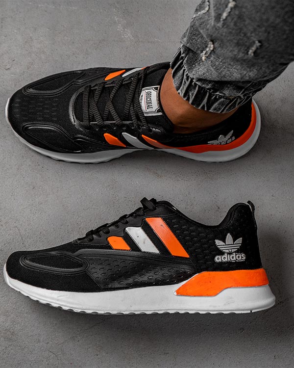 كفش ورزشي Adidas مردانه مشكي نارنجي مدل Tilda