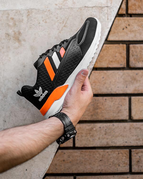 كفش ورزشي Adidas مردانه مشكي نارنجي مدل Tilda